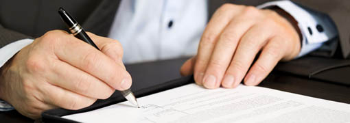 Man signing a document