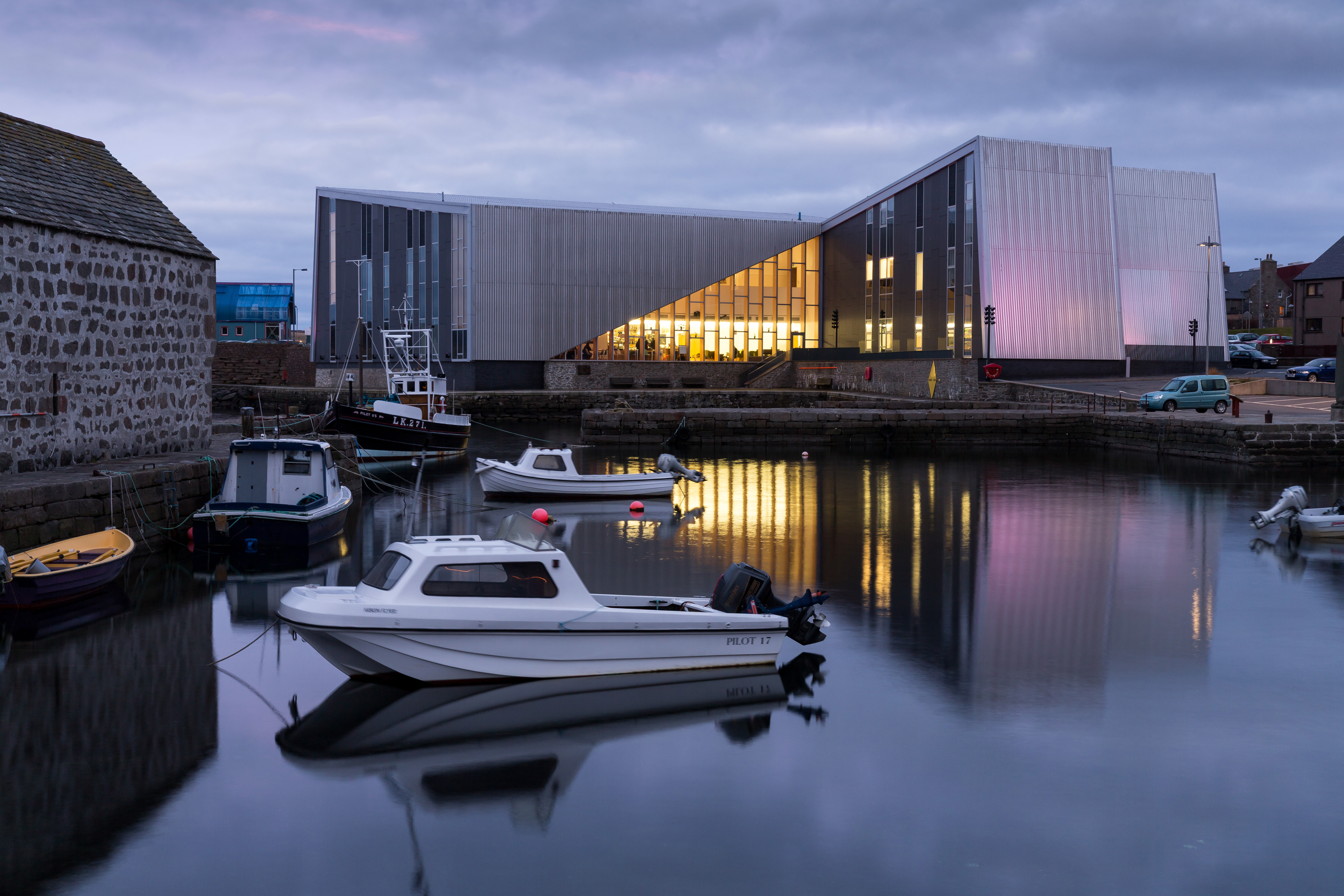 Shetland arts venue Mareel with boat in foreground