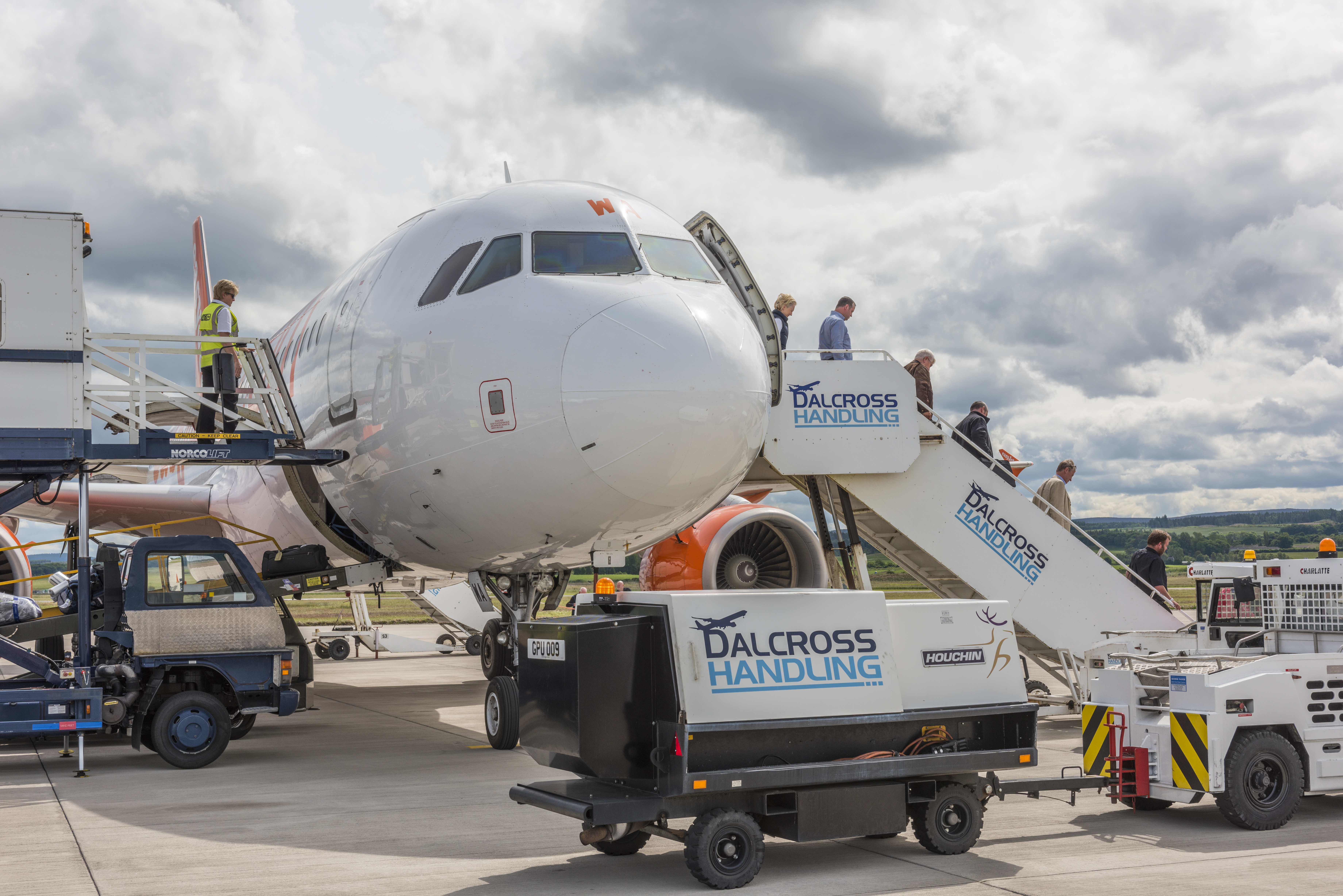 Passengers leaving a plane at Inverness Airport